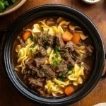 Crockpot Beef and Noodles in a rustic kitchen setting