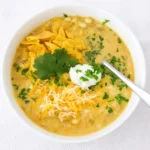 Green Enchilada Chicken Soup in a rustic bowl