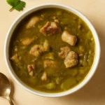 Hearty Green Chile Stew in rustic bowl