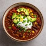 Crockpot Protein Chili in a bowl with toppings