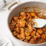 Healthy Orange Chicken recipe served with rice and broccoli