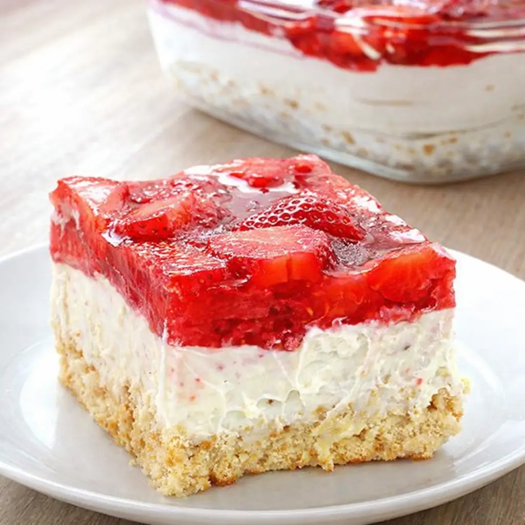No Bake Strawberry Heaven Cake layered with strawberries and cream