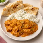 Quick and Easy Homemade Butter Chicken served with naan and rice