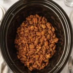 Slow Cooker Candied Pecans in a rustic bowl