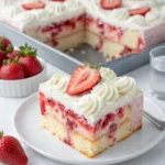 Strawberry Cheesecake Poke Cake slice with strawberries and cream
