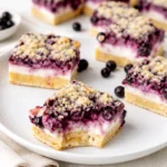 Blueberry Cheesecake Bars with golden crumble topping