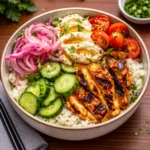 Cava Harissa Chicken Bowl with fresh Mediterranean toppings