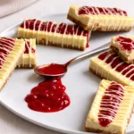 Copycat Philadelphia Strawberry Cheesecake Bars on a plate