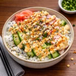A vibrant Easy California Roll Sushi Bowl with avocado, crab, and cucumber.
