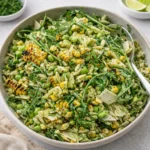 Grilled Corn Orzo Salad in a white bowl on a wooden table.