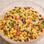 Quick Southwest Chicken Salad in a wooden bowl on a sunlit counter