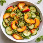 A fresh Spicy Peach Cucumber Salad with chili flakes and basil.