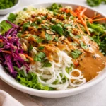 Spring Roll Salad with Peanut Dressing in a ceramic bowl