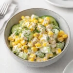 Street Corn Meets Creamy Cucumber salad in white bowl