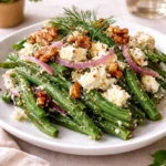 Fresh Green Bean and Feta Salad in a white bowl on a wooden table