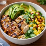 Honey Chipotle Chicken Rice Bowl with avocado and corn.