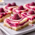 Freshly baked Lemon Raspberry Swirl Bars with powdered sugar