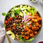 Roasted Sweet Potato Black Bean Bowl with avocado and crema