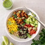 A vibrant Sweet Potato Taco Bowl with roasted vegetables and avocado
